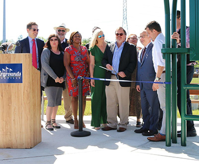 group photo of 'leash-cutting' grand opening ceremony